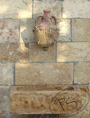 Biblical Stone behind a Roman Amphora Wall Fountain